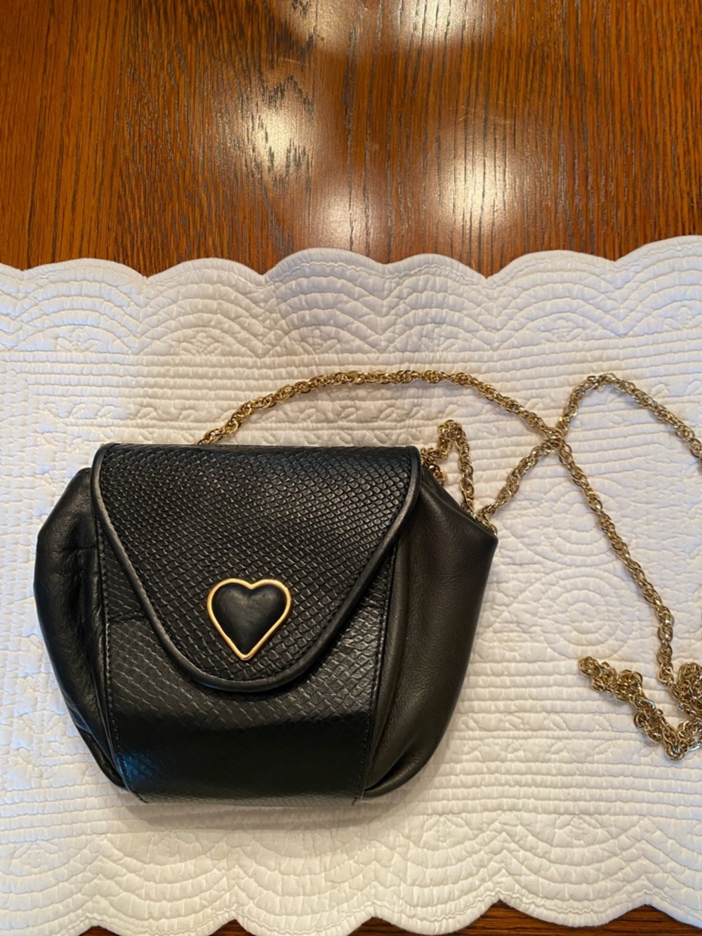Black Crossbody Bag with Gold Heart Accent and Chain Strap